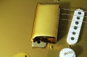 Fender_strat_gold_LTD_1989_cons_bridge_cover_1