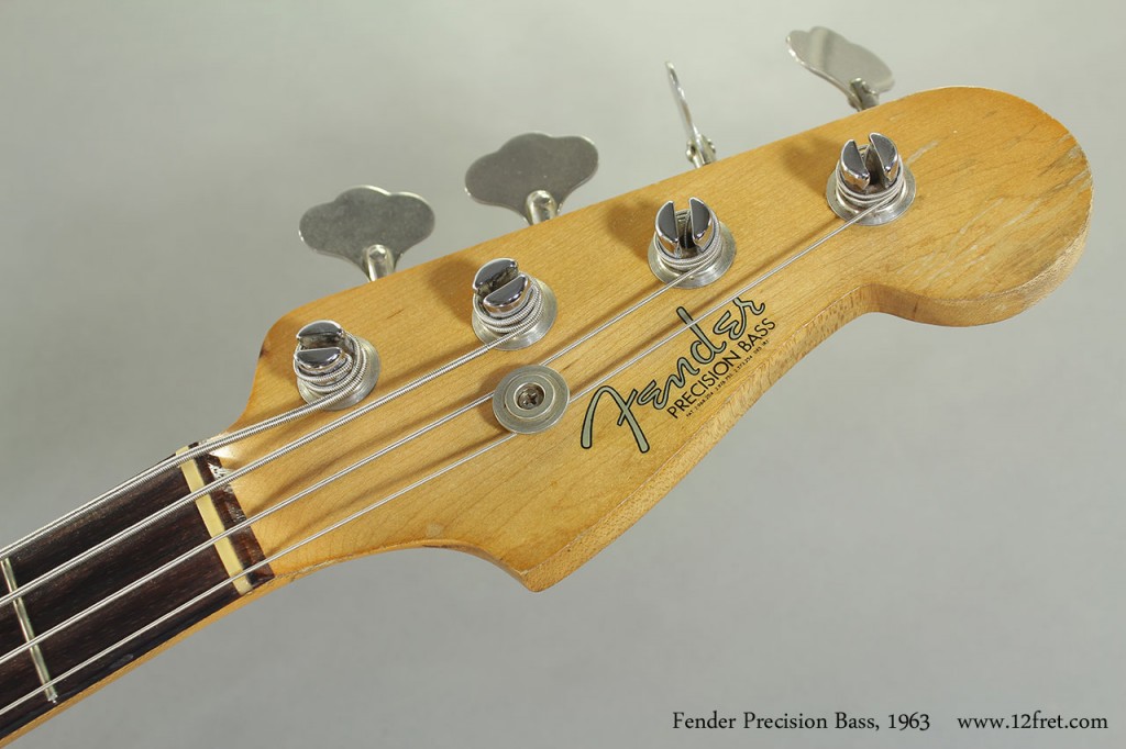This example of the 1963 Fender Precision Bass in Sunburst is in great playing condition, and is largely original.  There is lots of buckle wear on the back,  and the neck finish is worn; the decals are in good condition and not flaked off.