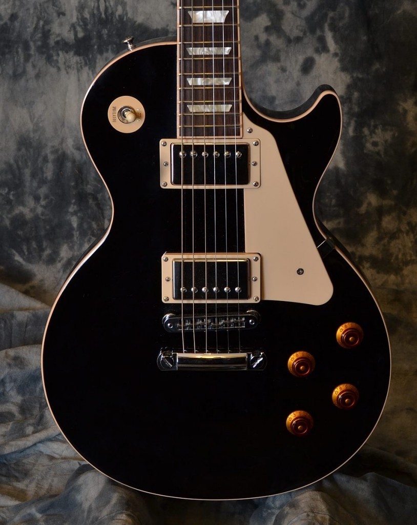 he Traditional .... the classic solid non chambered Les Paul with 57 Classic humbuckers! This guitar practically commands you to rock out!! This example is in excellent shape and comes with the original Gibson hardshell case.