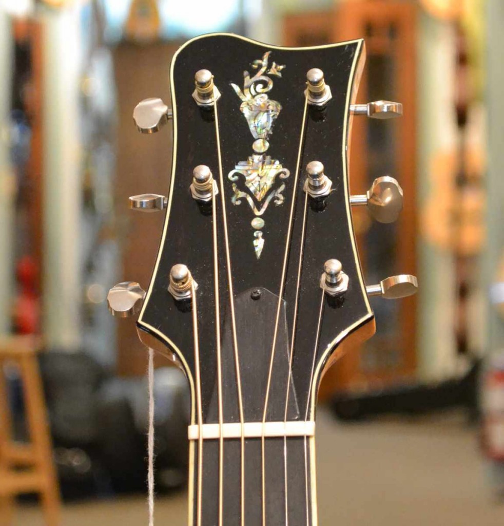 This Greenfield Slope Dreadnought features beautiful flamed maple and lovely inlay work. Selling for $3600.