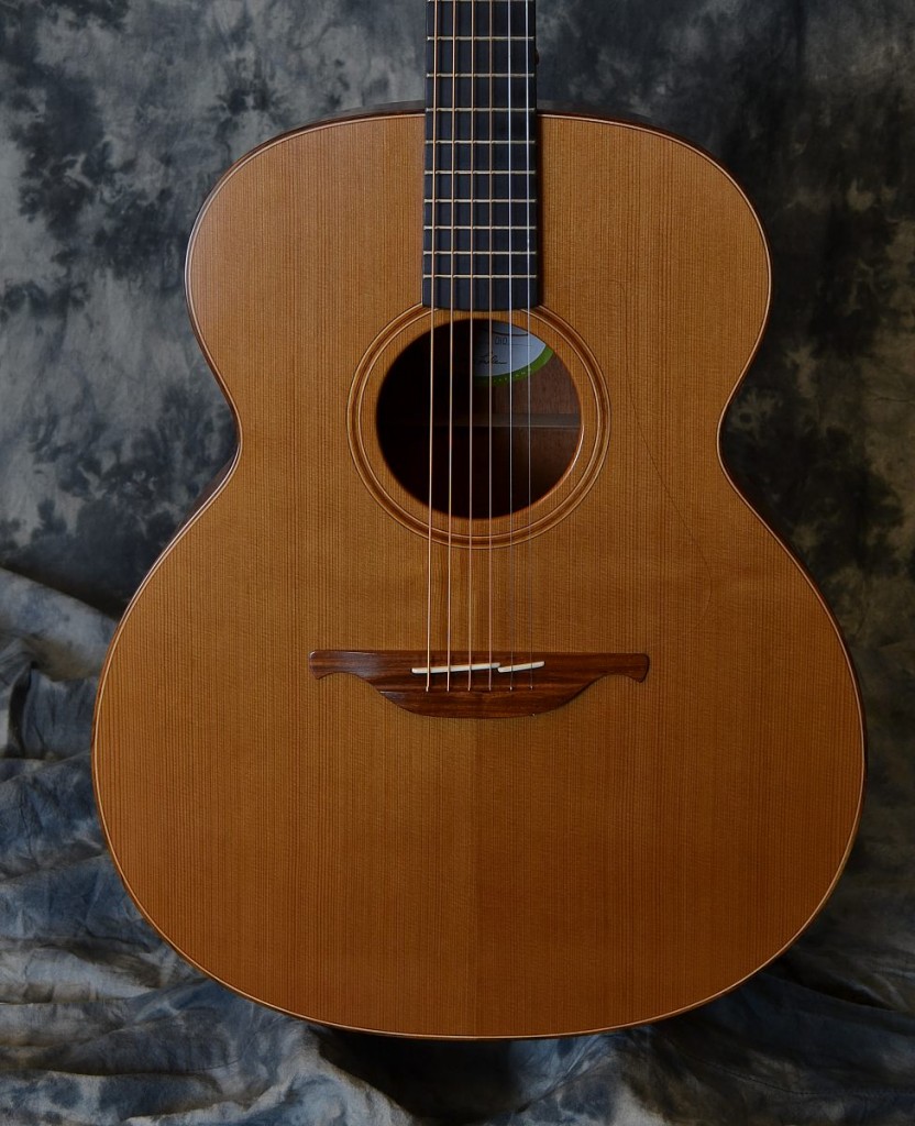 Here is a lovely cedar topped Lowden with mahogany sides and back. This warm and sweet guitar is great of fingerstyle and open tunings. It is in great overall shape with only minor play wear and comes with the original Lowden Hiscox case.