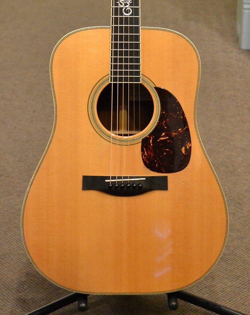 Here is a well used, awesome sounding Santa Cruz Tony Rice guitar selling for $2800.