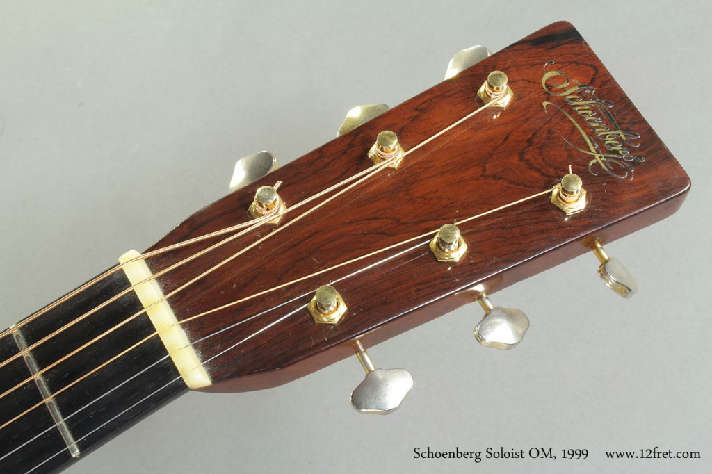 This specific 1999 Schoenberg Soloist OM was built by at Martin Dana Bourgeois before he launched his own shop and label.   It is built with an Adirondack Spruce top, Brazilian rosewood back,sides and headplate, mahogany neck, with snowflake-inlaid ebony for the fingerboard and pyramid style bridge.