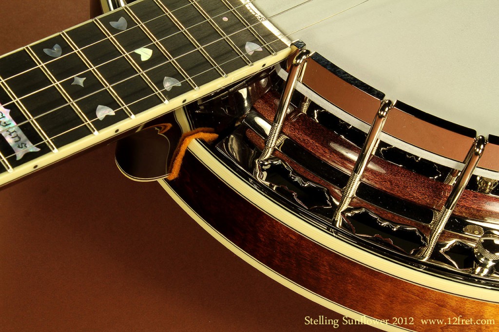 Here we have the Stelling Sunflower Banjo, another superb example of Geoff Stelling’s superb craftsmanship and creativity.  Based on the very successful  Stelling Bellflower Banjo , the Stelling Sunflower banjo features AAA-grade flame maple construction rather than Virginia Black Walnut.