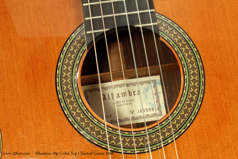 Here is a lovely 2008 Alhambra Model 10p Cedar Top Classical Guitar.    Alhambra guitars are built in Muro de Alcoy, in the Alicante region of Spain.  
The Alhambra Model 10p  is built with either spruce or cedar tops; this example from 2008 uses the Wester Red Cedar top.