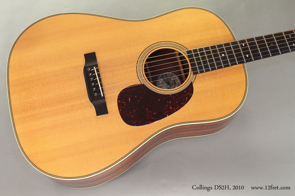 This Collings DS2H features a Stika Spruce top, Indian Rosewood back, sides and headplate, and ebony for the fingerboard and bridge. The top is bound with herringbone purfling and the back features a herringbone center strip.