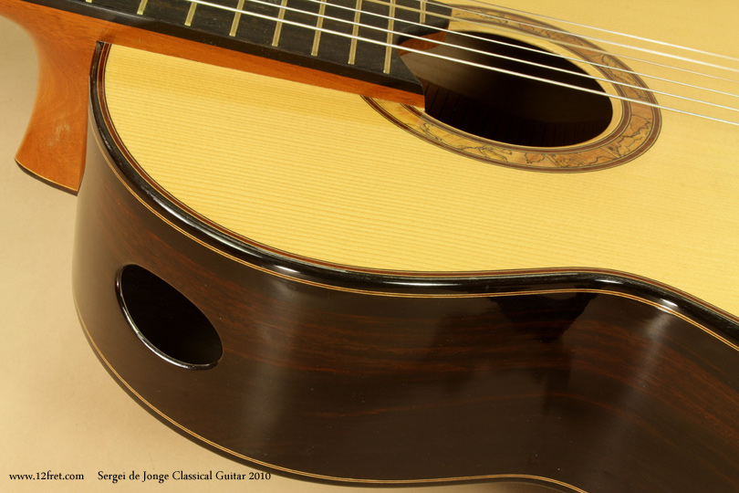 This is a beautiful 2010 Sergei de Jonge classical guitar with Brazilian Rosewood back and sides and an elevated fingerboard.  Sergei de Jonge builds from his shop in Chelsea, Quebec, and has for many years been prominent in the Canadian lutherie scene; he also runs courses out of his shop, including instruction on French Polish finishes.