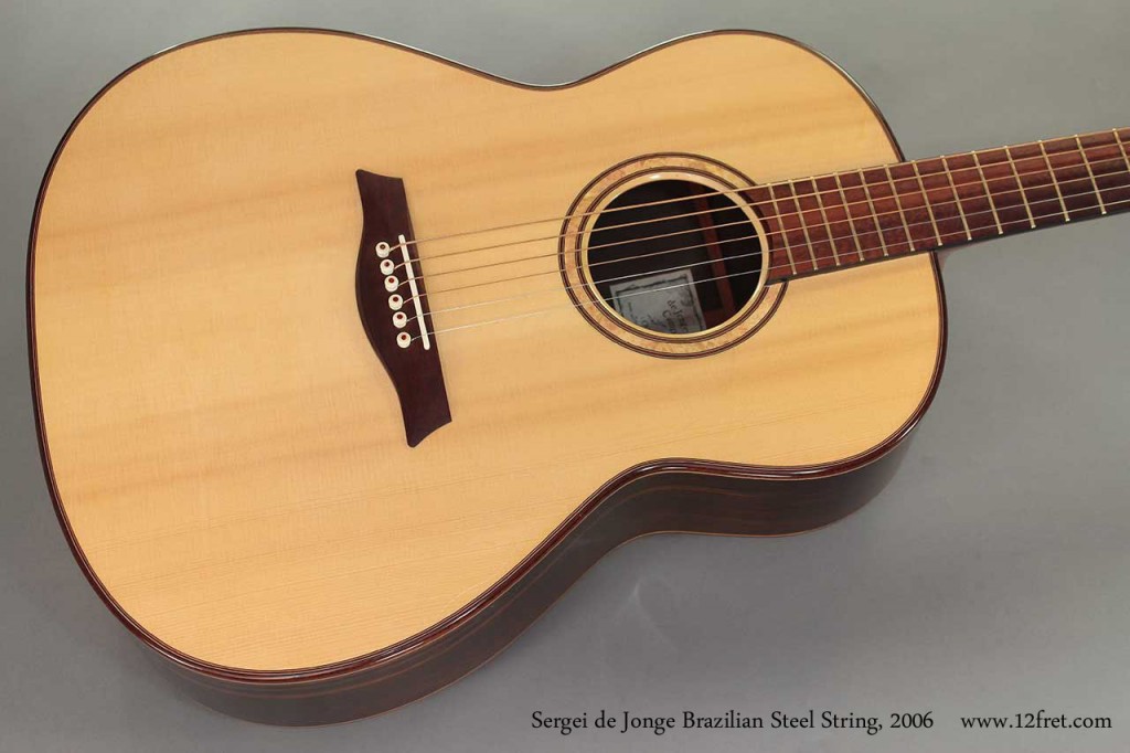 This lovely 2006 Sergei de Jonge Brazilian Steel String is in very good condition. Featuring a German spruce top, Brazilian Rosewood for the back, sides and headplate; snakewood for the ebony-bound fingerboard, bridge, binding and trussrod cover, and mahogany for the neck.