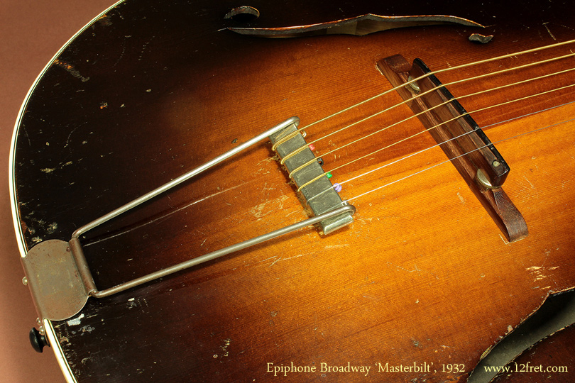 Epiphone began producing the Masterbilt series and the Broadway in 1931, featuring more elaborate decoration and the asymmetrical peghead seen here.   

This very early Epiphone Broadway model, from 1932,  is in great playing condition and is structurally sound.