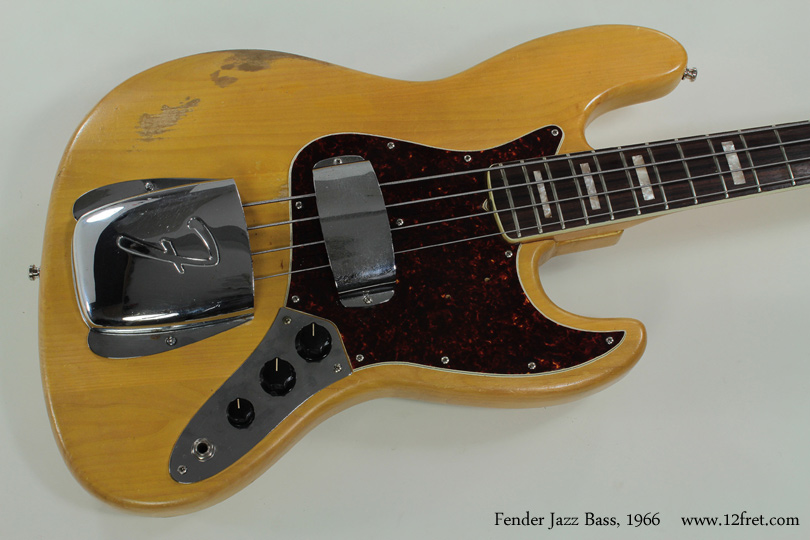 Here's a hardworking 1966 Fender Jazz Bass.  

Introduced in 1960, Leo Fender's Jazz Bass tends to have a tighter, more focused tone that doesn't emphasize the fundamental frequencies as much as the Precision bass does.   This helps it to move 'forward' in an audio mix, making it more popular in emerging musical styles where there was more emphasis on the bass - for example, rock power trios and funk.