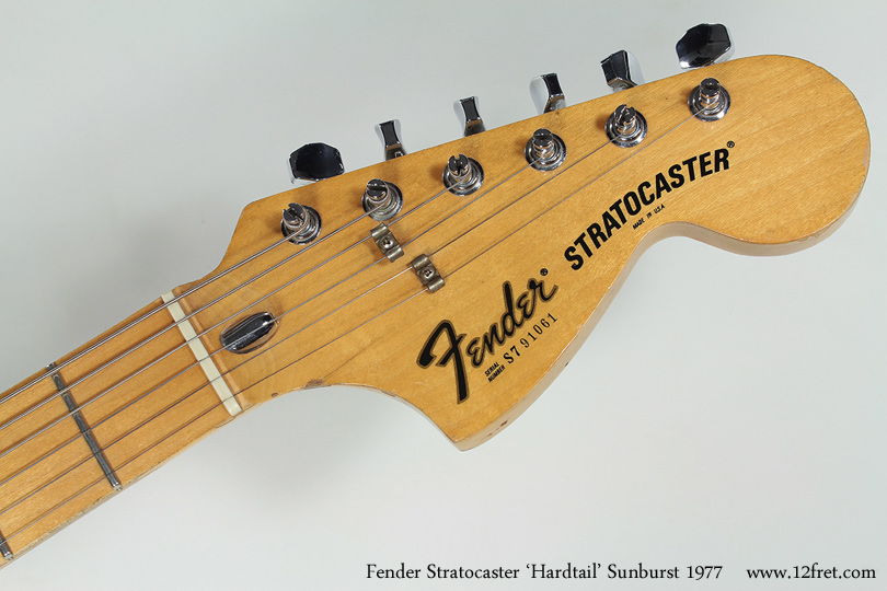 Here's a Fender Stratocaster 'Hardtail' from  1977.    The Stratocaster, one of the manifestations of Leo Fender's genius,  was introduced in 1954 with options for floating trem bridge and hard-tails, employing the back-of-body string ferrules found on the Telecaster.  The  hardtail verion was produced in smaller numbers until 2007, when it was discontinued.   Hard-tail strats have a little more attack, bite, and sustain due to the lack of spring tension  absorbing some energy.