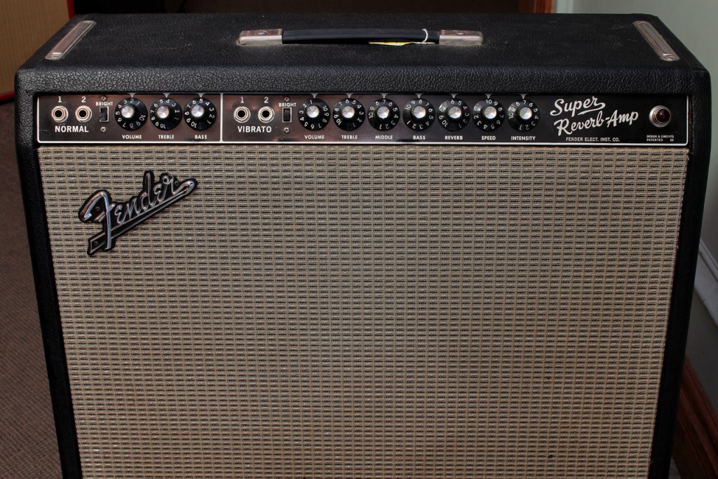 Here's a  very nice Blackface 1965 Fender Super Reverb Amplifier. 

The term 'Blackface' refers to the black panel with white script lettering, used on Fender amplifiers between 1964 and 1967.   They were preceded by 'Brownface' models and followed by 'Silverface'.   During the 'Blackface' period - in 1965 - CBS purchased Fender, but the new management made no changes to the amps until 1967, and those changes are seen in the 'Silverface' amps.