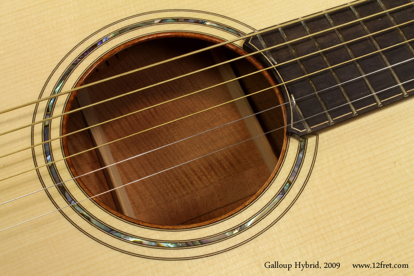 This 2009 Galloup Hybrid acoustic is a stunning instrument featuring top quality woods, very clean construction and great tone.  It also uses the patented Feiten tuning system, a combination of nut compensation, saddle placement, and tuning offsets designed to bring as many notes into tune with each other as possible.