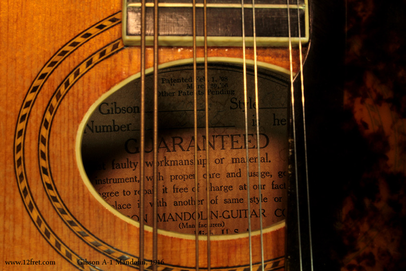 Here is a lovely Gibson A-1 Mandolin from 1916.  Gibson began producing the A-1 in 1902, featuring the teardrop shape and oval soundhole.  This model was produced on and off; the first run ended in 1918 and restarted in 1922, that run went to 1927, then the final run from 1933 to 1943.