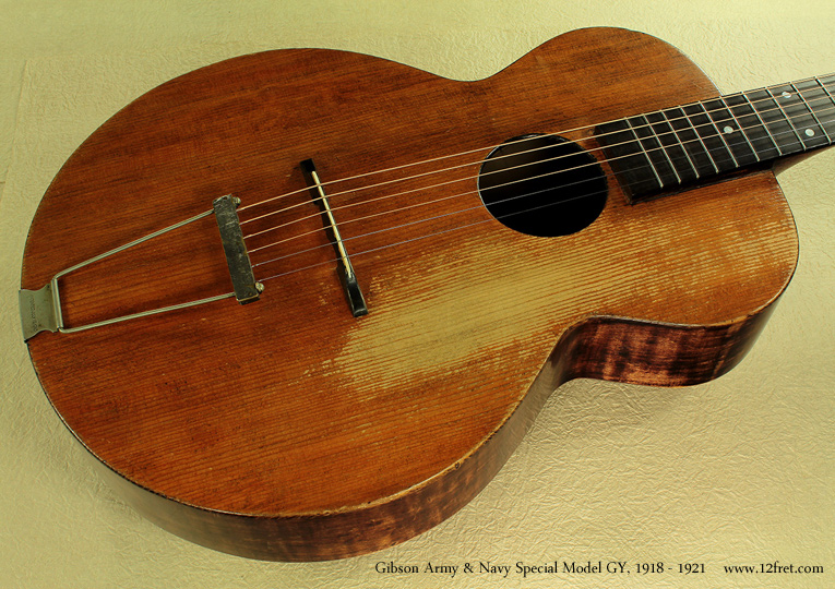 The Gibson Army Navy Special, Model GY, was a nearly flat-top version of the L-Jr. archtop (the top has a slight arch but is not carved) and was built between 1918 and 1921.   It was targeted to American servicemen during World War 1 and intended for sale at the local PX.  

These instruments are fairly rare and have often been played, a lot - like this one.   This is an interesting, quite playable, good sounding guitar with a definite history.