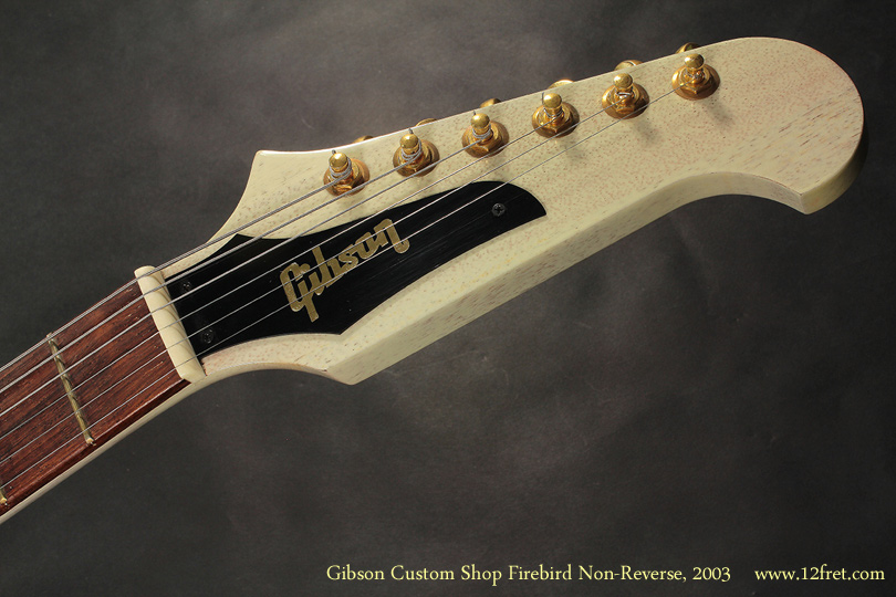 Here's a very cool Gibson Custom Shop Firebird Non-Reverse from 2003, in a 'TV White' or 'Limed Mahogany' finish.  

The Firebird was introduced in 1963 in the 'Reverse' form, where the lower cutaway is longer than the top.   However, due to poor sales and some complaints from Fender, Gibson essentialy flipped the body and head to this 'Non-Reverse' form.  Additionally, the 'Non-Reverse' models use a set neck, rather than a through-neck, construction.