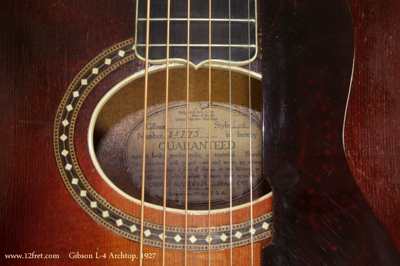 The Gibson L-4 was built between 1912 and 1956, and underwent a number of changes.   Originally it had - like many archtops of the time - an oval soundhole; this changed to a round soundhole in 1928, and finally to the now-common F-holes in 1935.
