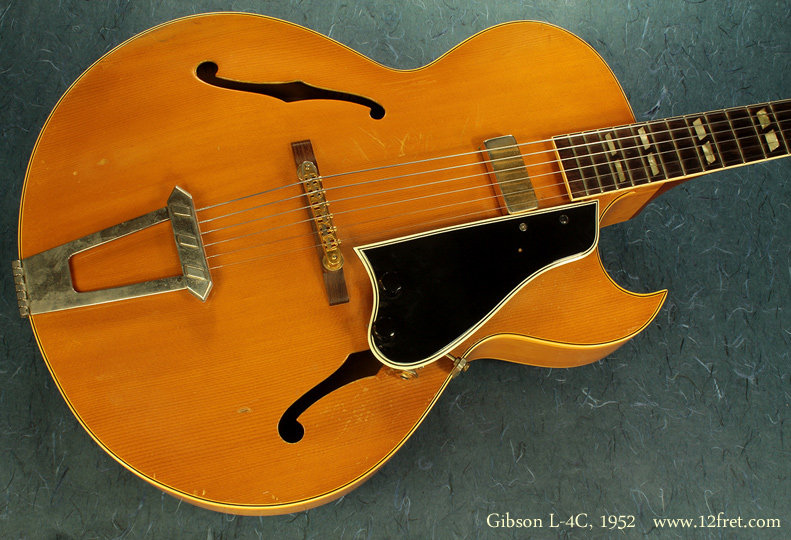 Here is a very nice Gibson L-4C from 1952.     The L-4C was a cutaway version of the L4, and while this guitar was originally fully acoustic the pickup has been added to the pickguard so the body isn't modified.   The L-4 and L-4C feature a fully hollow body with a carved spruce top coupled with maple laminate back and sides.  The L-4 was produced from 1912 to 1956  and the L-4C was produced from 1949 to 1971.