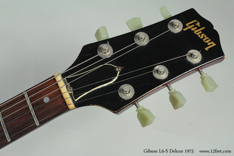 This is a 1975 Gibson L6-S Deluxe.    

Introduced during 1973 in collaboration with Bill Lawrence, the L6-S was meant to provide a very versatile instrument at a lower production (and sales) cost, and to appeal to rockers who wanted something different than a Les Paul or SG, and to jazzers who remembered the big L-series archtops.