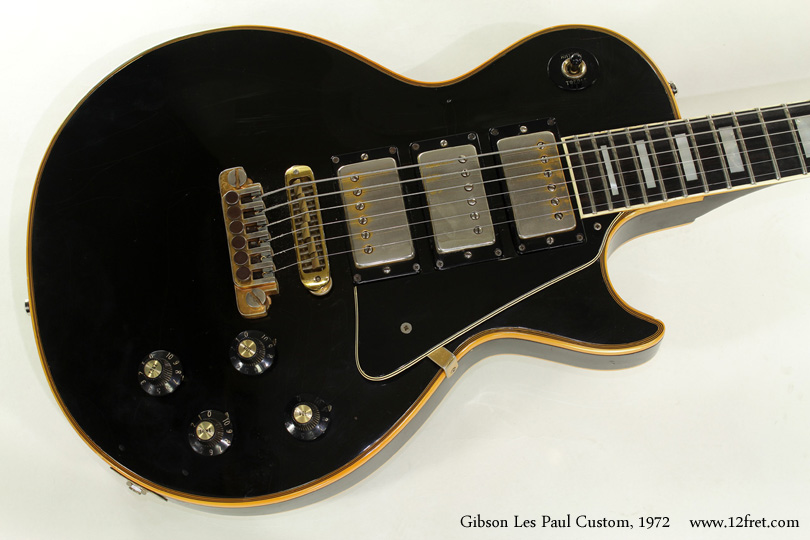 The Gibson Les Paul Custom model was introduced in 1954 as an upmarket version of the still-infant Les Paul model.   Instead of a maple cap on a mahogany slab, the body was all mahogany, and came in black with gold hardware.   The original versions featured single-coil Alnico pickups, notable for their rectangular polepieces, and the now-ubiquitous Tune-o-Matic bridge and stop tailpiece combination.