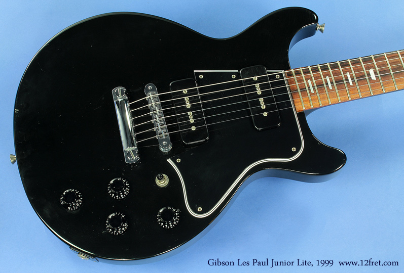 Now THIS is a rock guitar! Here's a Gibson Les Paul Junior Lite from 1999, looking remarkably like a Les Paul Special.    The Les Paul Special was introduced in 1955 as a sincle-cutaway guitar to provide a lower cost model in the Les Paul line, and it immediately took a place in the rock arsenal. In 1958, it received a major makeover with the double-cut (DC) body design, which provides unrestricted access to all the frets. However, the DC model was discontinued during 1960, in favour of the new body design that became known as the SG.

Over the years, the Double-Cut body shape has been reissued.   From 1999 to 2002, Gibson produced the guitar shown here, is a Special with P-100 hum-cancelling soapbar style pickups and mini trapezoidal markers, and called it the Junior Lite.