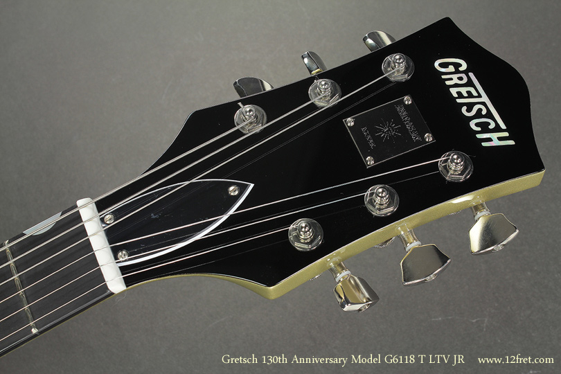 Here is the very, very cool Gretsch 130th Anniversary Junior - G6118T LTV JR.    Gretsch has from time to time made smaller-bodied versions of their guitars, perhaps to balance out the giant Falcon and Country Club models.  

But this isn't a 'Mini' guitar - the body is smaller, close to the size of a George Benson model, but it's full scale so the tension and tone are all there.