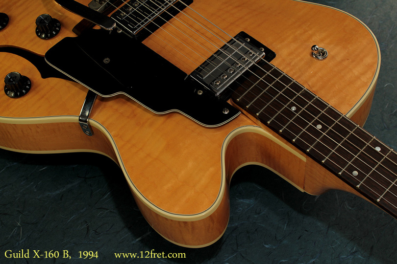 Here's an excellent condition Guild X-160 B from 1994.   The X-160 is a hollow-body archtop made using maple and with a single venetian (rounded) cutaway, and the B stands for 'Blonde'.
