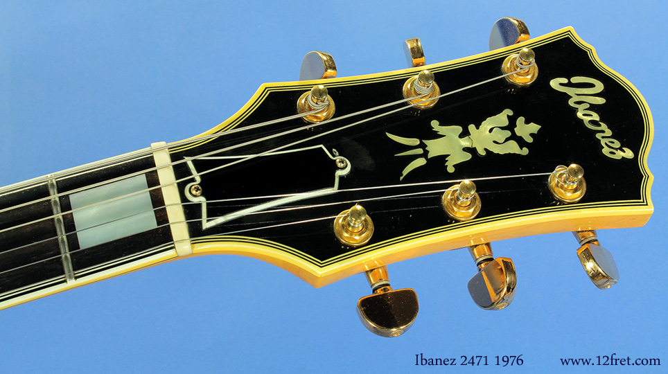 Ibanez produced a large number of good copies of popular brand guitars, and at their top end were renderings of the 'Johhny Smith' archtops.  This 1976 example, the model 2471, is in good shape with a modification - the volume and tone controls, originally mounted on the pickguard, have been moved to the top.  

Despite being a close copy, this is not what's known as a 'lawsuit' model.   The lawsuit was over Ibanez' use of the open-book headstock shape, and by this time Ibanez had stopped using that design, opting for this shape which they still use.  

This is a really, really nice instrument and is priced far below what it copies.    We know of one top local jazz player who has used one of these for years.