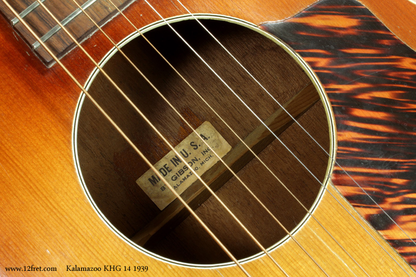 The 1939 Kalamazoo KHG 14 is very much like the Gibson L-00, but without the truss rod.  It's had its bridsge replaced, cracks have been repaired, and has been converted from Hawaiian setup to 'standard' fingerstyle.
