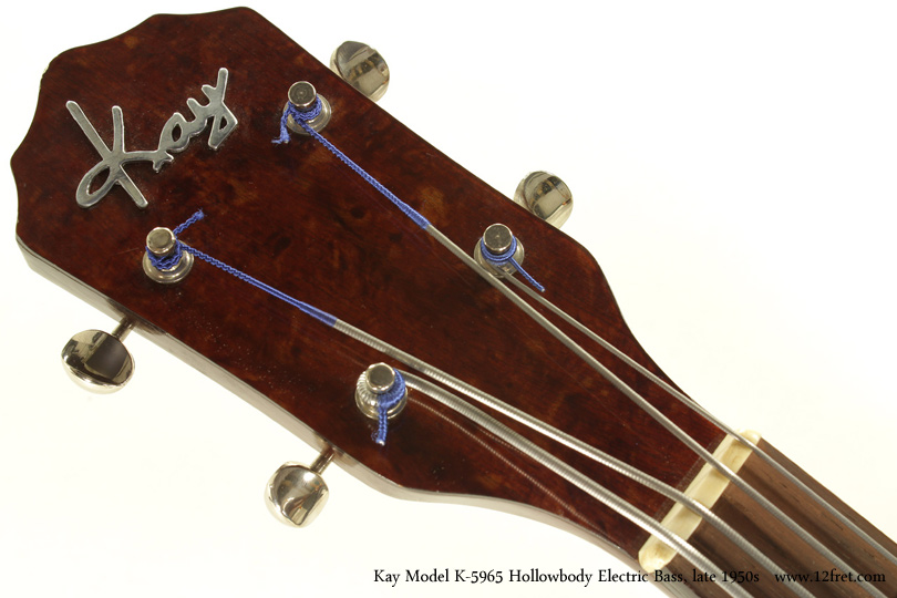 This is likely the best-condition Late 1950s Kay Model K5965 Hollowbody Electric Bass I've seen.    There's very little wear and one mark on the back.   It looks like it's spent most of its life in its case.