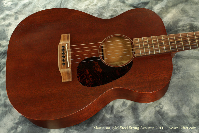 Here's a near-perfect 2011 Martin 00-15M steel string acoustic guitar.   The 00 body style is one of the earliest Martin designs, 
dating to 1877 with a 12-fret neck and 1934 with the 14 fret neck.