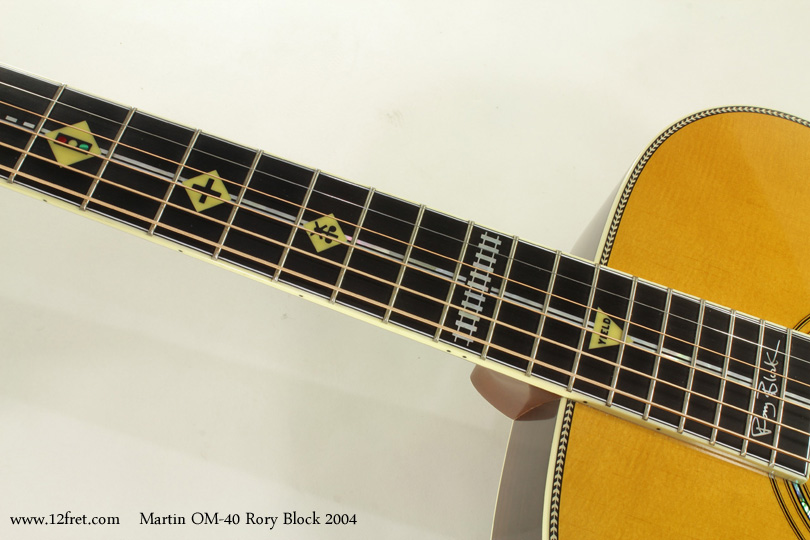 This is very nice - a 2004 Martin OM-40 Rory Block in great shape.    Aside from the basic fact that the OM guitar design works so well from tonal and playability perspectives, this guitar is very attractive and has an unusual 'Road' themed inlay pattern!