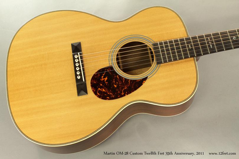 For The Twelfth Fret's 35th anniversary in 2011,we commissioned a number of instruments including this Martin OM-28 Custom.   Featuring a spruce top and Indian Rosewood back and sides, with herringbone binding on the top and 'zipper' back strip, this guitar is in very good condition.