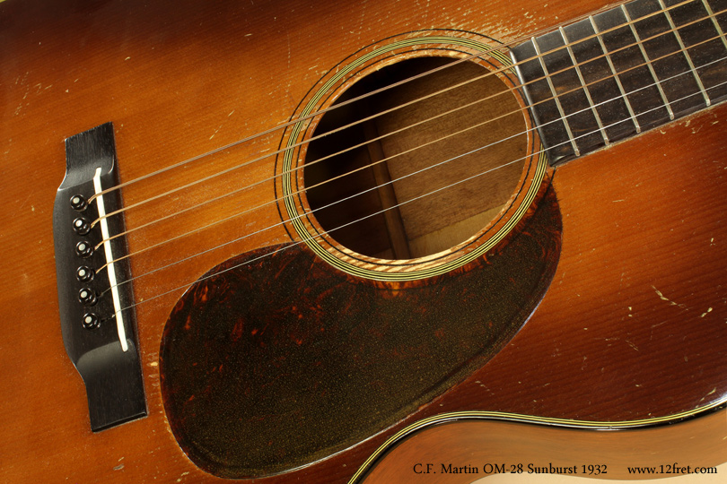 This is a rare 1932 Martin OM-18 Sunburst.   During 1932, the C. F. Martin guitar company produced 3,000 instruments in total. The OM-18 features the Orchestra Model body, with a tighter waist  and slightly narrower bouts than the Dreadnought design.   It's also sometimes known as the 000 size.