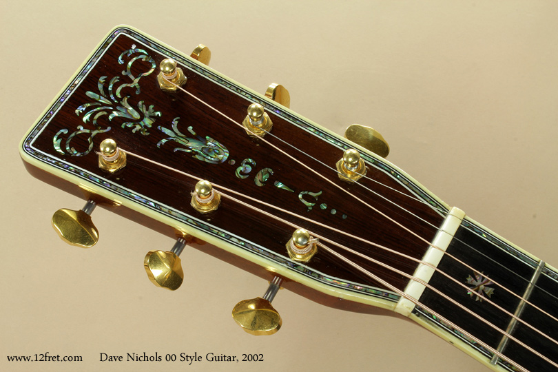 Dave Nichols has spent decades doing custom inlay work, including a lot for Martin.   His work shows a high degree of familiarity with pearl inlay - it looks like it was easy for the builder to do, a sure sign that it isn't. 


This 2002 Dave Nichols 00 Style acoustic guitar is in good playing condition and looks fantastic.