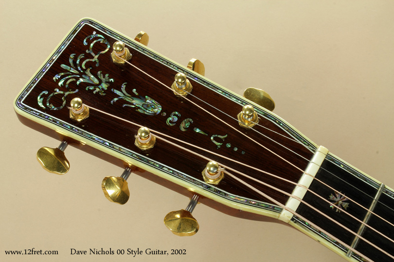 Dave Nichols has spent decades doing custom inlay work, including a lot for Martin.   His work shows a high degree of familiarity with pearl inlay - it looks like it was easy for the builder to do, a sure sign that it isn't. 


This 2002 Dave Nichols 00 Style acoustic guitar is in good playing condition and looks fantastic.