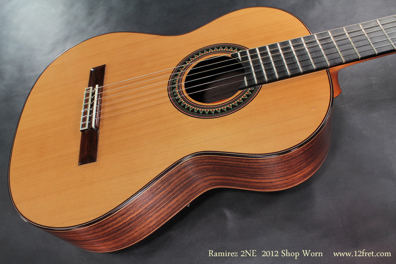 New Shop Worn Ramirez model 2NE.     Built in late 2012, this guitar is virtually unplayed  and comes with full warranty.  
A customer bopped the top with another guitar last week and put two chips in the top near the edge of the upper bout.  They are filled with fresh finish, so the top is protected, but it is not invisible.