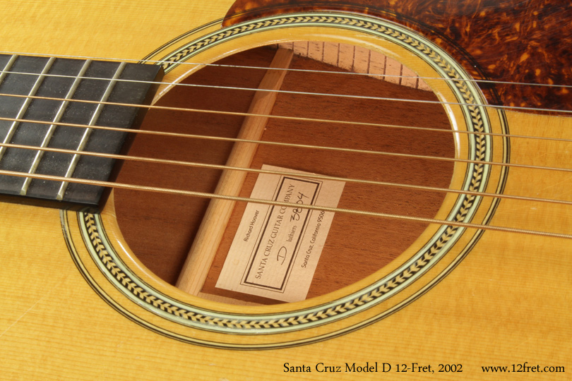 The Model D 12-Fret was originally built by Santa Cruz for Norman Blake. The 12-fret neck moves the bridge closer to the center of the vibrating surface, increasing power and responsiveness.   The top, bracing and large 4.25 inch sound hole deliver presence throughout the instrument's range. 

This 2002 Santa Cruz Model D 12-Fret Dreadnought is in great playing condition. It speaks quite loudly and clearly, with lots of articulation and sparkle on the upper end, but without overwhelming bass.