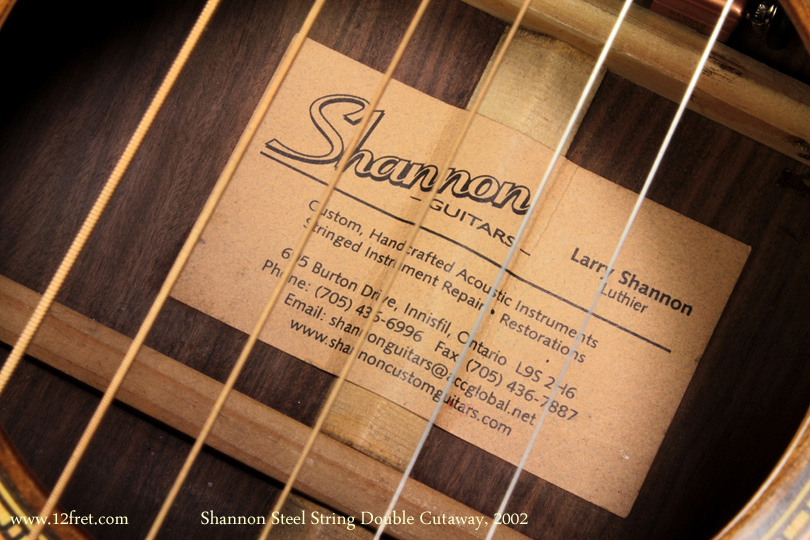 Here's a 2002 Shannon Double Cutaway steel string acoustic. 
For some time, Canada has had a lot of independent instrument builders, working away all over the country.   Larry Shannon has been building in Innisfil, Ontario for some time.