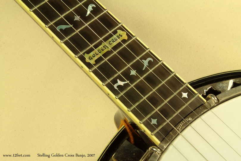 In absolutely mint condition, this 2007 Stelling Golden Cross Banjo looks like it just came out of a time machine. 

Geoff Stelling builds spectacular banjos and the the Golden Cross is actually named after Tony Golden, a friend and one of Stelling's early customers.