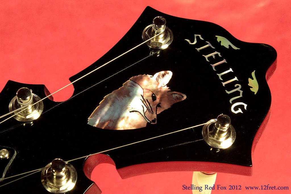 This is a beautiful Stelling Red Fox banjo, a brand new model,  with Stelling's unique bronze 'Wedge Fit' tone ring fitted to a Tony Pass 'Lost Timbre' block rim. The Red Fox inlay on the headstock is really quite fetching.