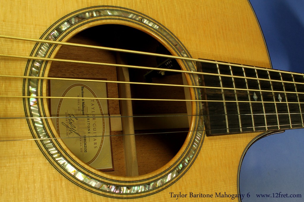 Check out the lush sonic cocktail of the Taylor Baritone Grand Symphony Mahogany 6 String!
