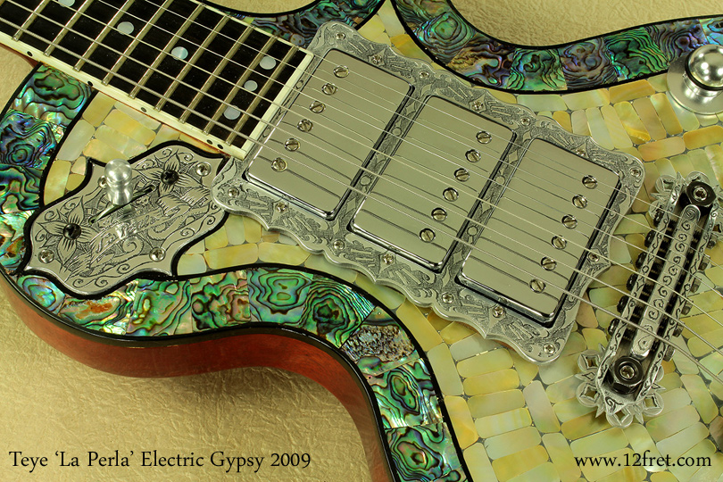 Built in Austin, Texas, this 2009 Teye 'La Perla' Electric Gypsy is something to behold!   Heavily decorated with inlay and engraving using a wide range of materials, the 'La Perla' is near the top of Teye's line.